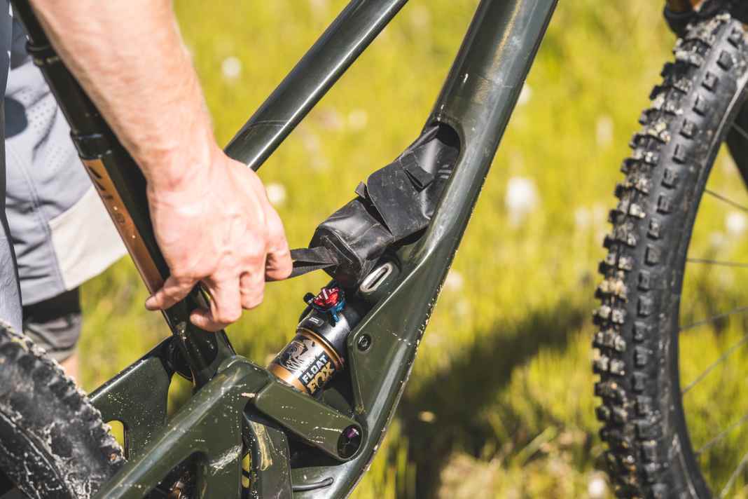 The storage compartment with small opening comes with a waterproof bag and spare derailleur hanger.