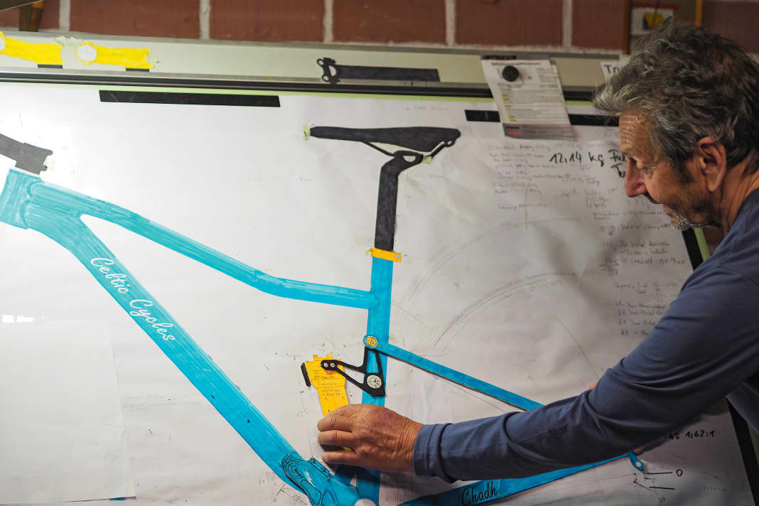 Old school: Richard designs classically on the drawing board instead of the computer. Swing arm and damper prototypes are made of cardboard.