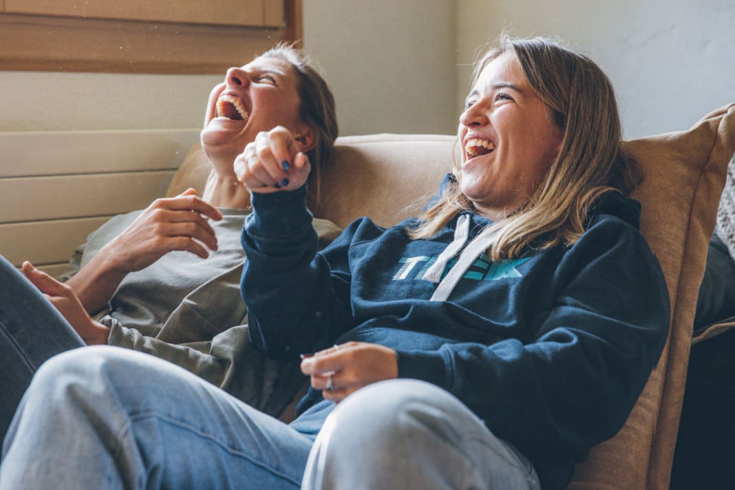 Two power women who have a good laugh.