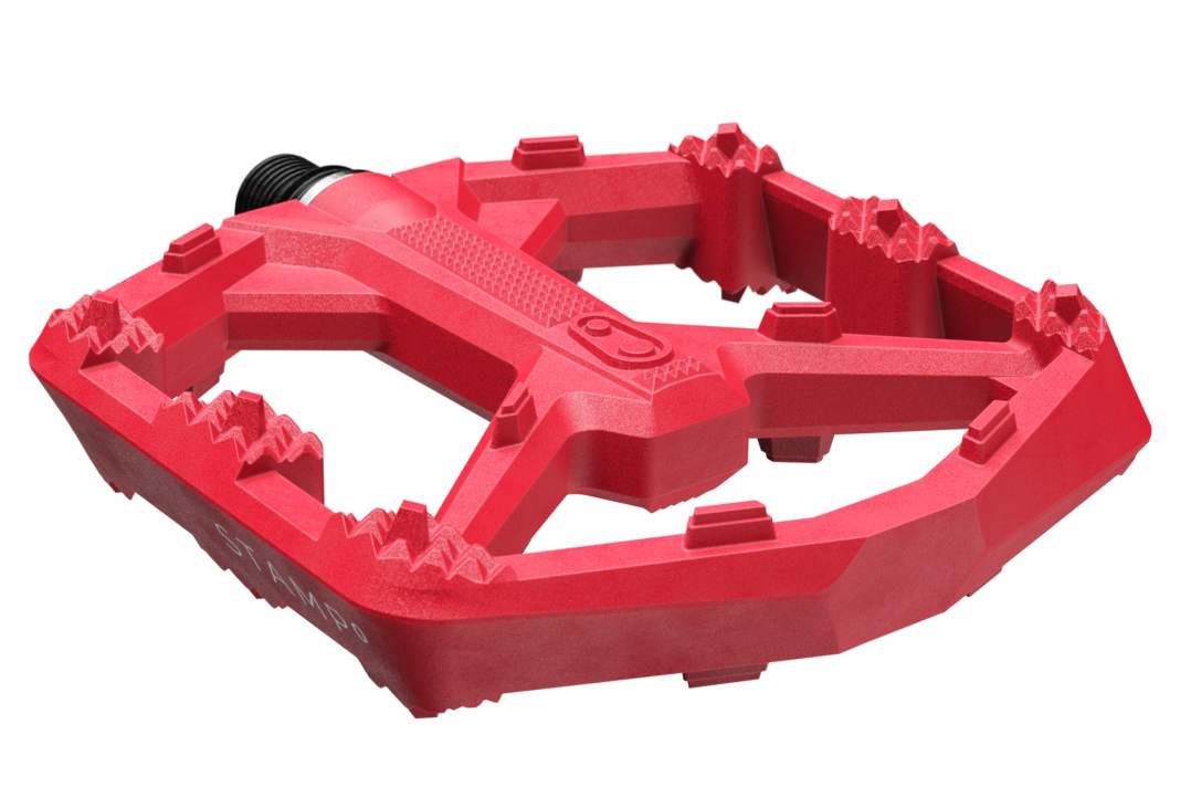 The Stamp 0 plastic pedal in bright red is...