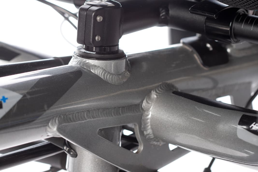 Directly in front of the rider's seat: head tube with "stem" and handlebar connection.