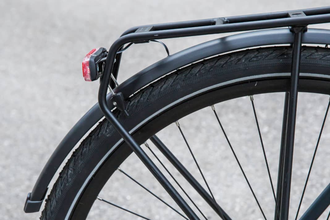 The pannier rack twists under load. The stub struts between the rear light and mudguard then rub against the tyre.
