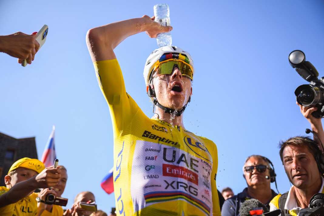 Tadej Pogacar at the finish line on Alpe d'Huez