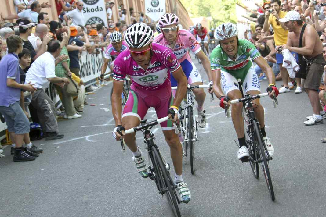 Along the steep path to the basilica on a hill above Bologna, thousands cheer on the athletes during cycling races | Alessandro Trovati