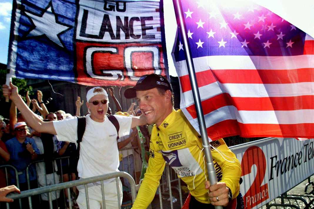 Lance Armstrong celebrates victory in the 1999 Tour de France on the Champs Elysees.
