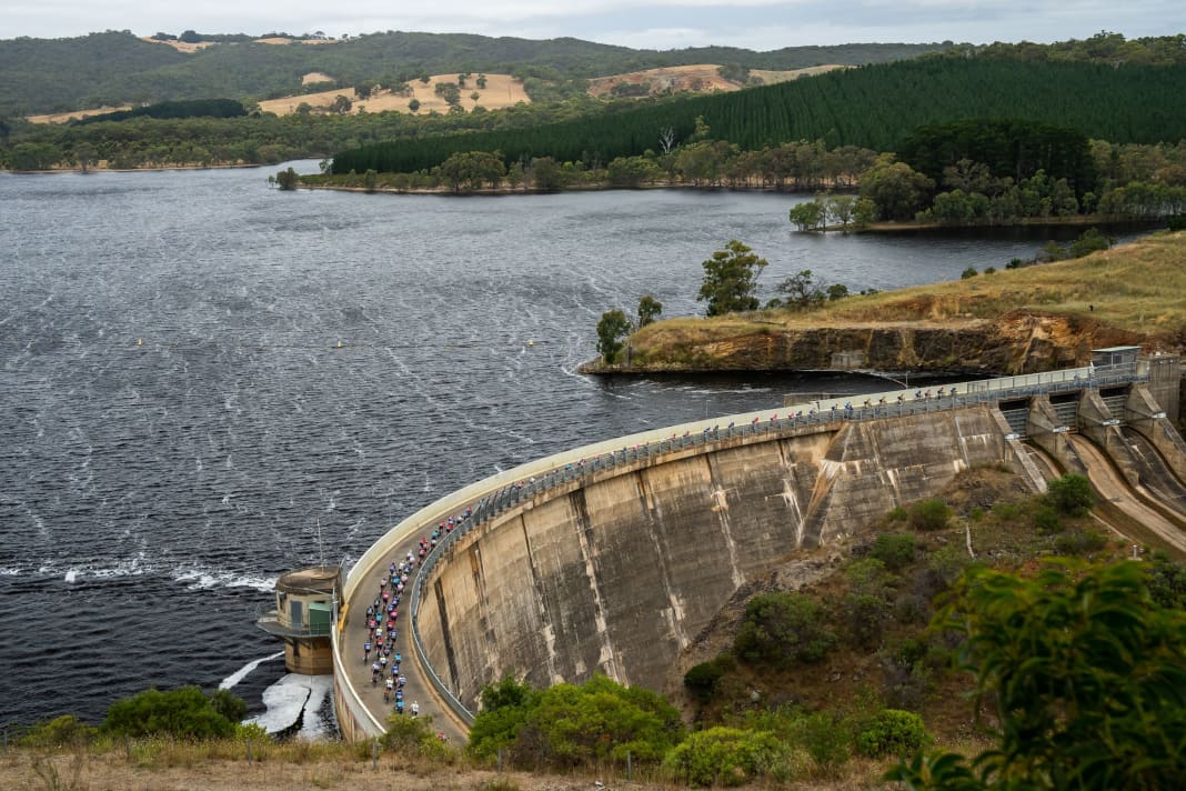 The peloton crosses the Myponga Dam during the second stage of the Tour Down Under 2023 in Australia.