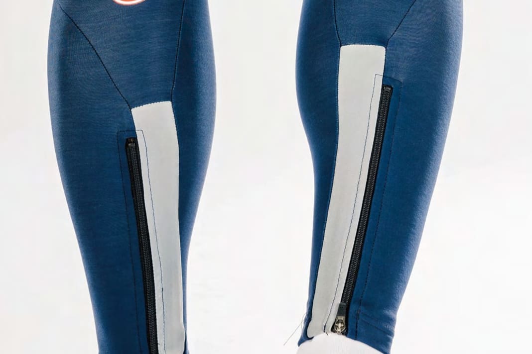 Castelli : jambes du pantalon avec beaucoup de matériel réfléchissant ; les fermetures éclair facilitent l'enfilage et le retrait du pantalon