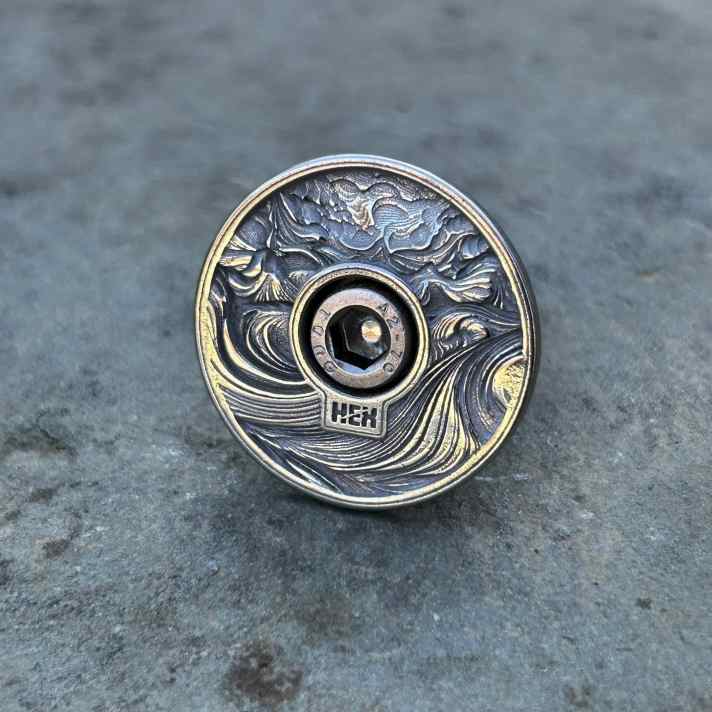 The top caps from Hex Components also come out of the 3D printer - in either titanium or steel