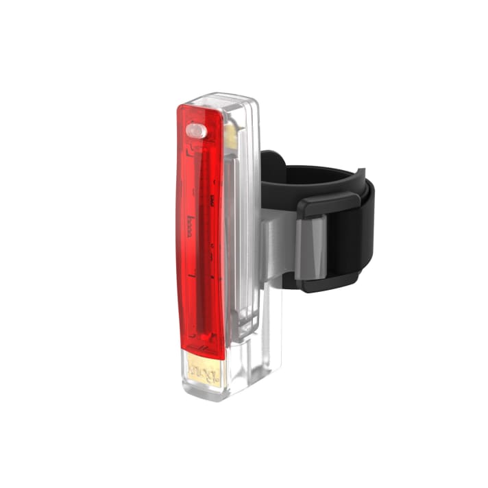   Transparent housing, red LED light: the Knog Plus for use on the bike or for other outdoor activities. The USB charging plug can be seen shimmering gold behind the lettering at the bottom.