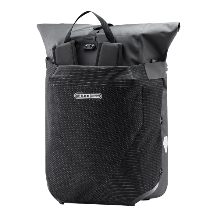 The flap covers the straps and protects them from dirt whilst riding