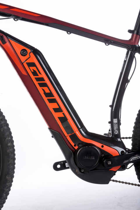   Giant stows the battery in the oversize down tube, giving it the classic frame design of a motorless mountain bike. The battery powers a Yamaha motor.