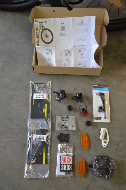 Decathlon adds lights, bells and cat's eyes as accessories - pedals, tool, Srams Chaingap tool and spare spokes are also included.