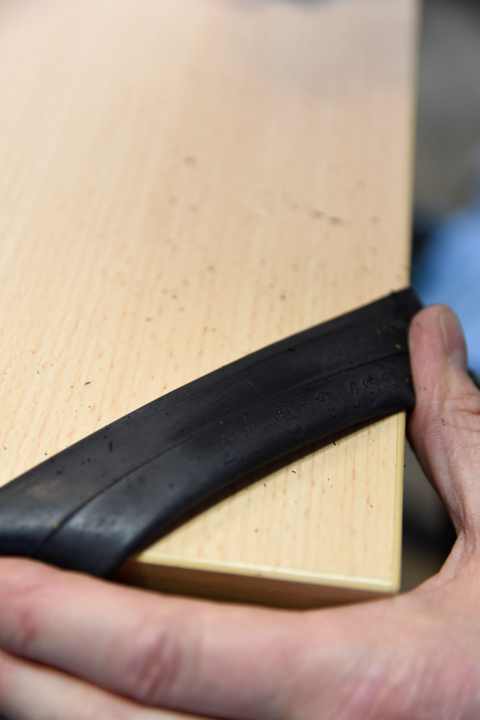 To patch the hose, place it on a sturdy, smooth surface such as a table.