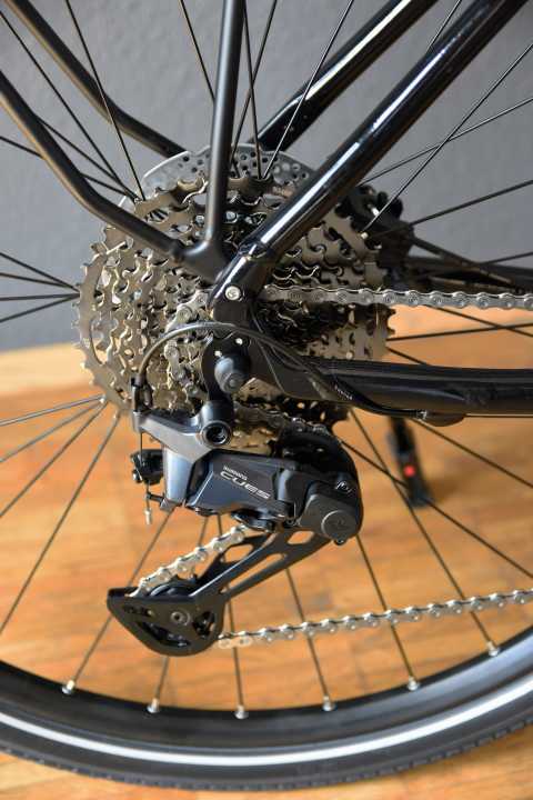 Shimano has developed sprockets with a wider base and specially adapted chains for the new Cues groupset; shifts a little slower, lasts three times longer.