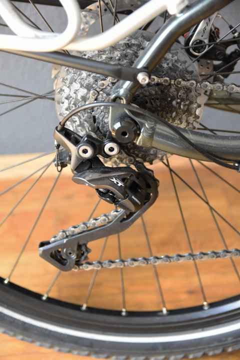 Shimano XT's second-highest shifting group is known for shifting comfort, but requires new wear parts more often than the Cues.
