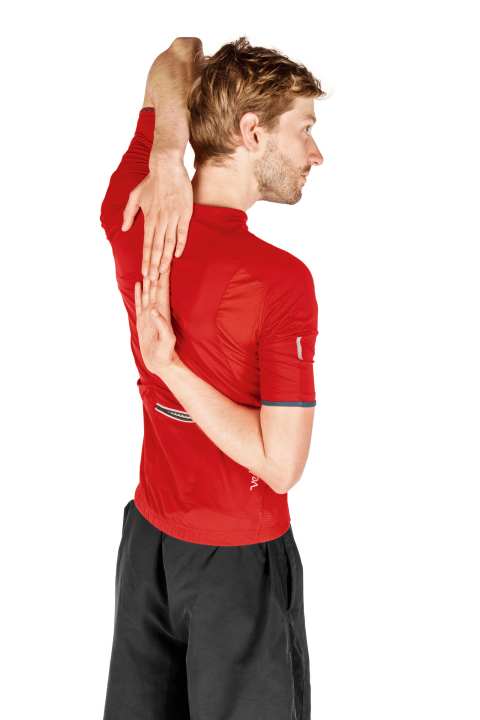   Stretching exercise for the shoulders that opens the chest.