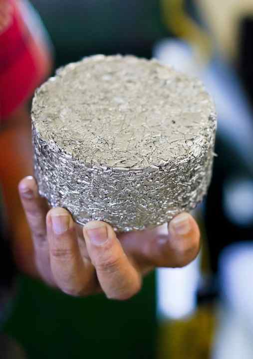 A machine presses the turnings into recycling-friendly pucks. The pressed oil is also reused.