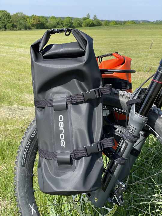 The large one holds 12 litres. Almost too big for the rear carrier.