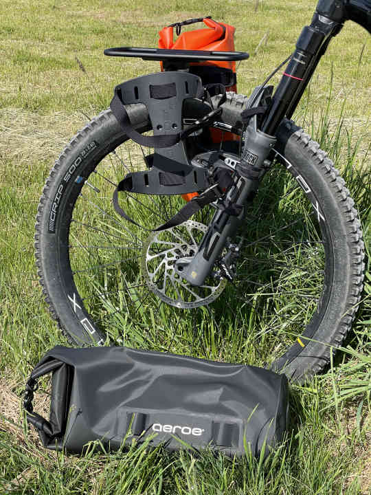 The straps on the "Spider Cradle" together with the loops on the front of the pack sack hold everything firmly in place.