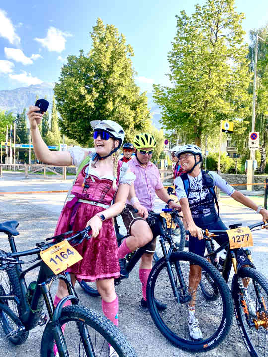 Also back in a dirndl this year: traditional costume biker Petra Zeller (left), who has achieved cult status in the marathon scene thanks to her outrageous outfits and casual YouTube videos.