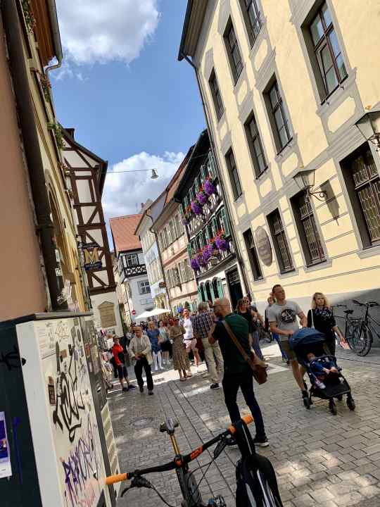 Slaloming through the streams of tourists in Bamberg's old town centre. But a stop at the Schlenkerla was a must.