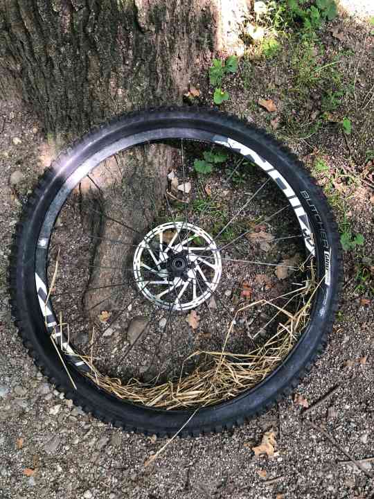 Grass instead of air: Don't kid yourself - rolling into the valley with a flat tyre will damage the rim. Aaron Gwin has demonstrated that this is possible - check YouTube - but better: pad it out well!