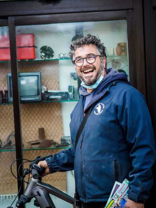 Francesco in front of his shop "Eco Bike" - a household goods shop with e-MTB hire.