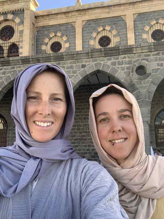 Swap a cycling outfit for an abaya - the authors in the elegant garb of Arab women.