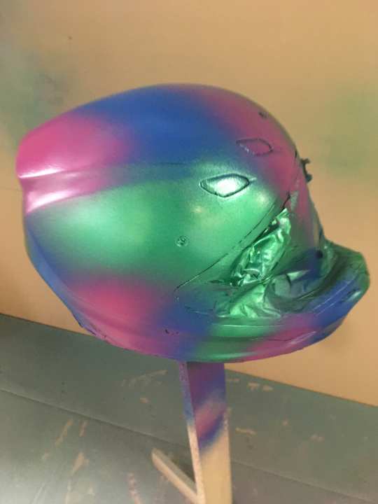 For our desired design, we first have to paint the helmet green, then blue and purple.