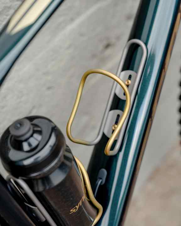 Where is the battery for the front light? In the matching painted bottle.