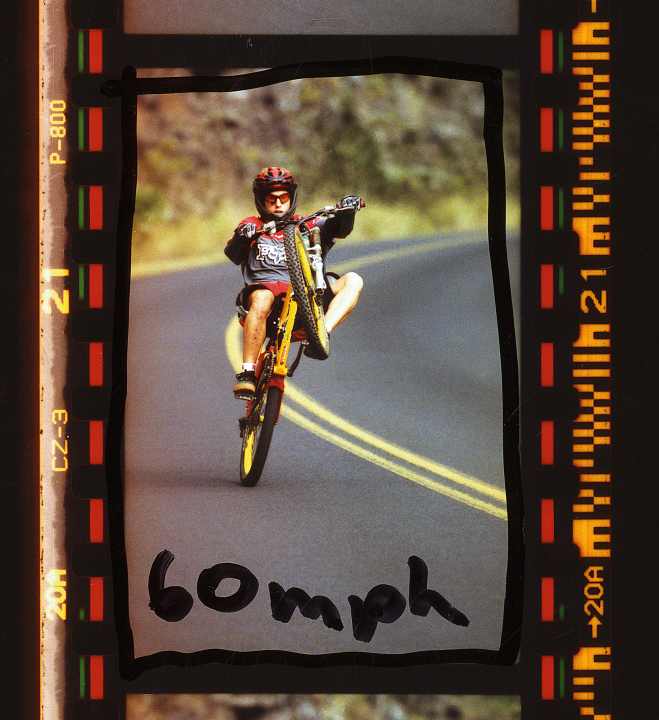 Surfing on tarmac: Bobby Root races down the coastal road at almost 100 kilometres per hour. "60 mph," wrote photographer John Gibson on his slide.