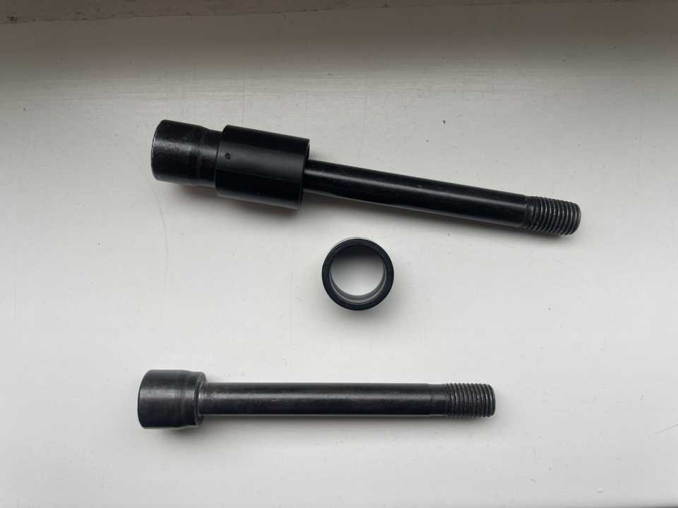 The "upgrade kit" (pictured) works like an expansion plug: when tightened, a conically shaped bolt head presses the bushing onto the frame - which jams into the frame and is now also firmly seated in the frame on the non-bolted side.