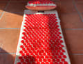 According to the manufacturer, the OrthoMat is the first acupressure mat with a vibration function.