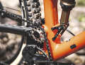 The idler pulley has a small chain guide and deflects the chain near the pivot point. The interchangeable lower shock mount allows for different wheel sizes and shock lengths.