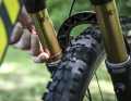 Then assume the riding position and push the wipers on the fork and damper all the way down