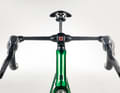 Modern: The narrow handlebar/stem combination with inwardly angled shift brake levers is reminiscent of professional material.