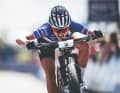 Biting: Loana Lecomte approaching the finish line at the XCO World Cup in Nove Mesto na Morave, Czech Republic.