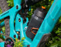 The solution comes from bikepacking equipment supplier Restrap. Bottle cage with side opening!