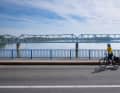 Cyclists cross the wide border river unhindered