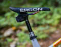 An Ergon SM10 E-MTB saddle with oil-slick rails clamps onto the RockShox Reverb AXS seatpost. Pushed forwards as far as possible for the best uphill control!
