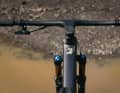 A one-piece carbon handlebar/stem combination saves weight on the top model.