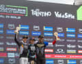 The men's podium in Val di Sole: Goldstone ahead of Brosnan and Daprela.