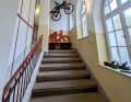 The staircase takes visitors to the first floor of the museum, where the tour officially begins.