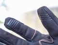 The thumb and index finger are covered with non-slip silicone and still work on the smartphone