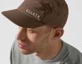 The CLLCTV Core 5 Panel Cap from the Core Collection features an adjustable clip fastening and is also water-repellent