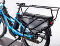 The extended luggage rack can be fitted with a rail, footrests and side guards to make it suitable for carrying children.