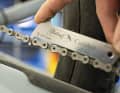 Measure chain elongation: Timely chain replacement not only prevents chain breakage, it also protects the expensive sprockets. A gauge is used for measuring. The chain shown here has almost reached the wear limit of 0.075 mm per link.