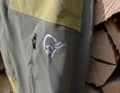 The Norrøna logo is reflective and the zip opens the large ventilation slit.