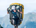 Here Thomas completes a 100 metre run with a giant Deuter rucksack.