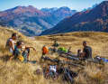 Markus, Hannes and Günther enjoy the autumn sun. If you want to complete the Sella Ronda in one day, you don't have too much time to rest. Here, a puncture means a forced break.